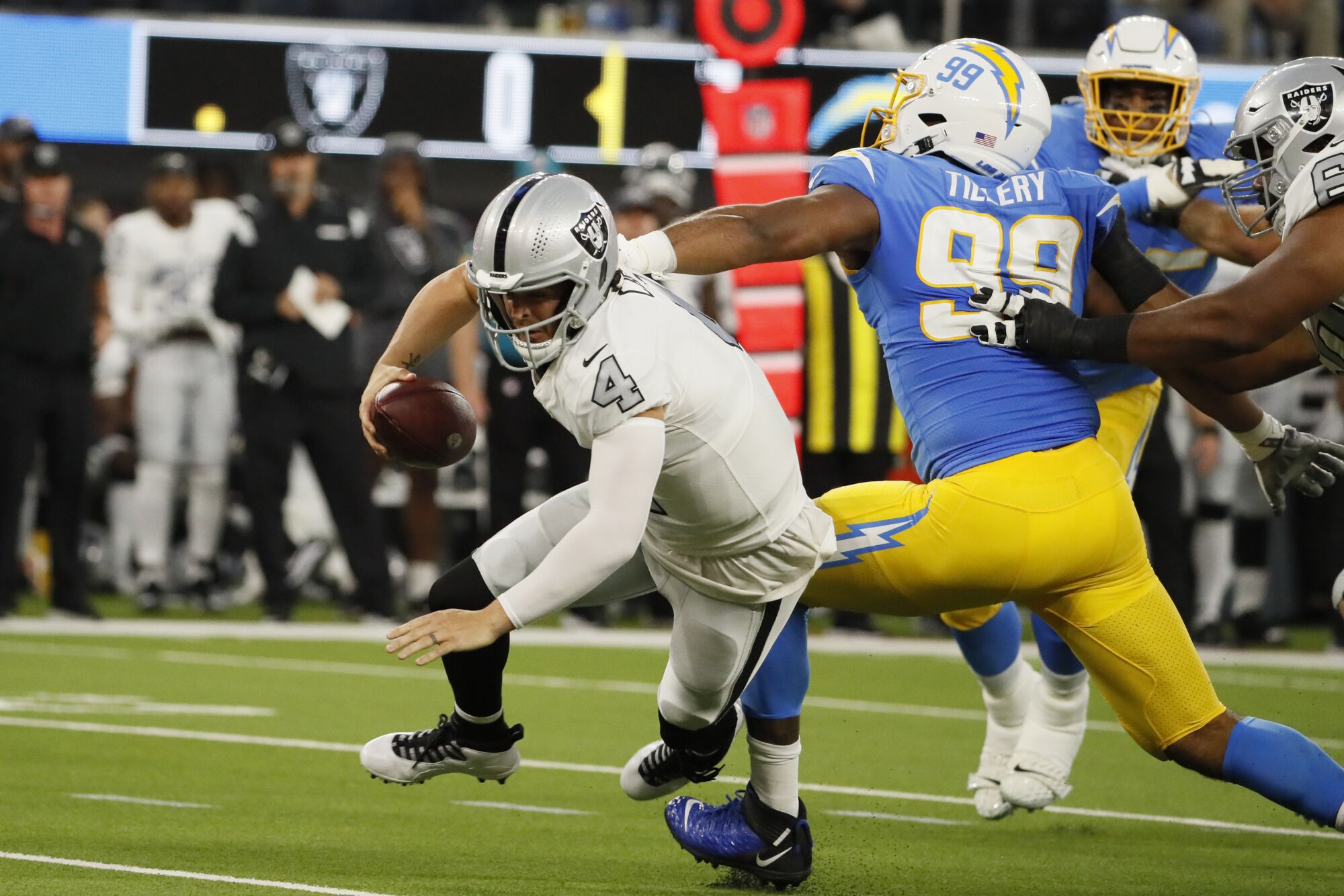 Chargers defensive tackle Jerry Tillery sacks Raiders quarterback Derek Carr during the first half.