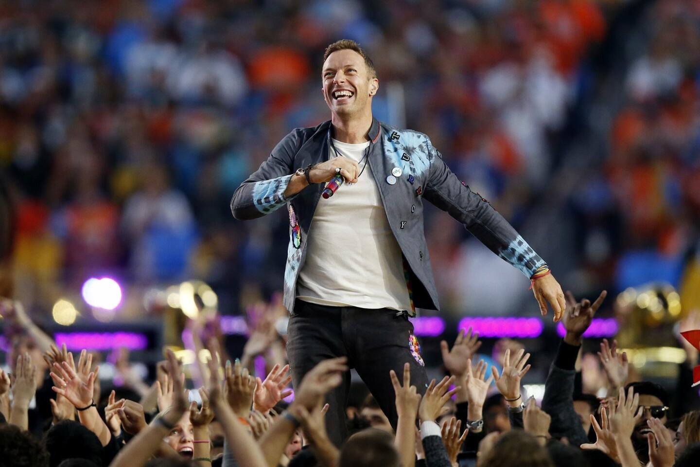 Chris Martin of Coldplay performs during the Pepsi Super Bowl 50 Halftime Show on February 7, 2016 in Santa Clara, California. Photo by Ezra Shaw/Getty Images