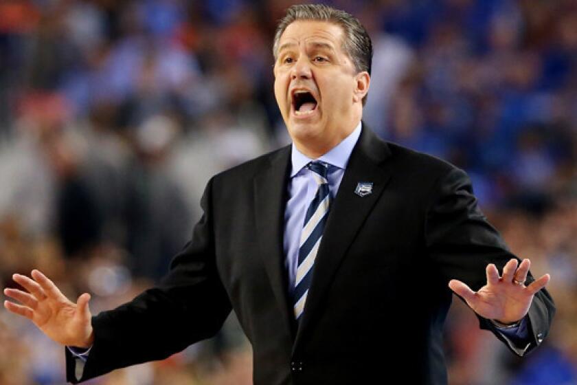 Kentucky Coach John Calipari instructs his players during Monday's NCAA championship game against Connecticut. Is Calipari interested in coaching the Lakers?
