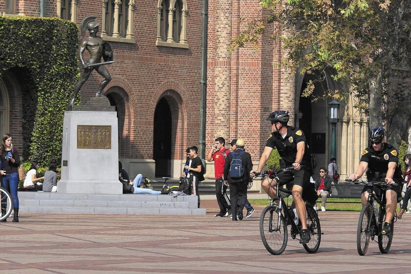 Officers patrol the USC campus in 2012 the day after four people were shot outside a Halloween party by a young man aiming at a rival gang member.