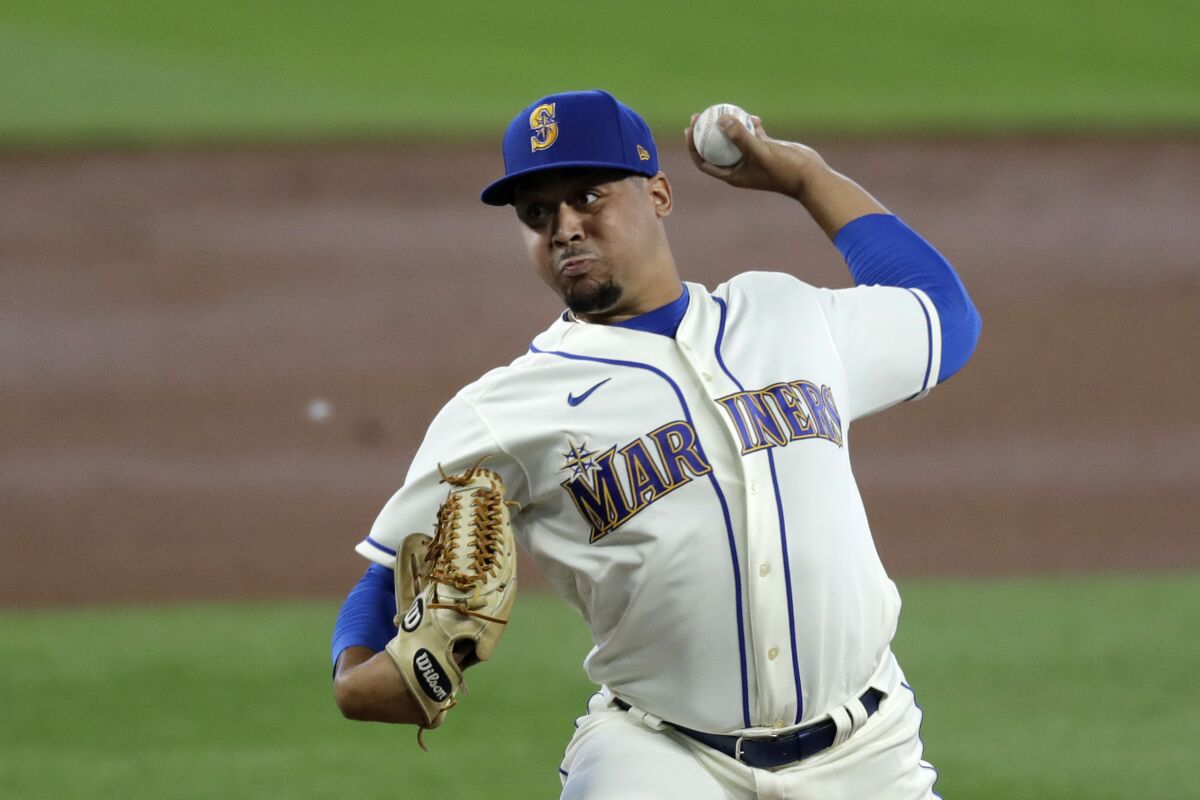 CORRECTS TO STARTING PITCHER - Seattle Mariners starting pitcher Justus Sheffield throws against the Colorado Rockies in the second inning of a baseball game Sunday, Aug. 9, 2020, in Seattle. (AP Photo/Elaine Thompson)