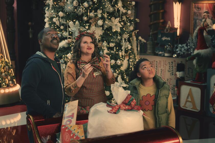 A dad (Eddie Murphy) & his young daughter flank a Christmas-decoration store worker who is considerably more than she seems.