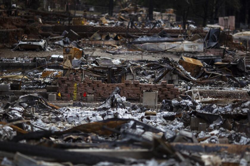 PARADISE, CALIF. - DECEMBER 12: The remains of Edgewood and Sawmill Estates community, in the Camp Fire decimated town of Paradise on Wednesday, Dec. 12, 2018 in Paradise, Calif. (Kent Nishimura / Los Angeles Times)