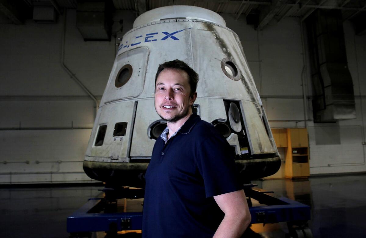 SpaceX Chief Elon Musk stands in front of a Dragon capsule in Hawthorne in 2012.