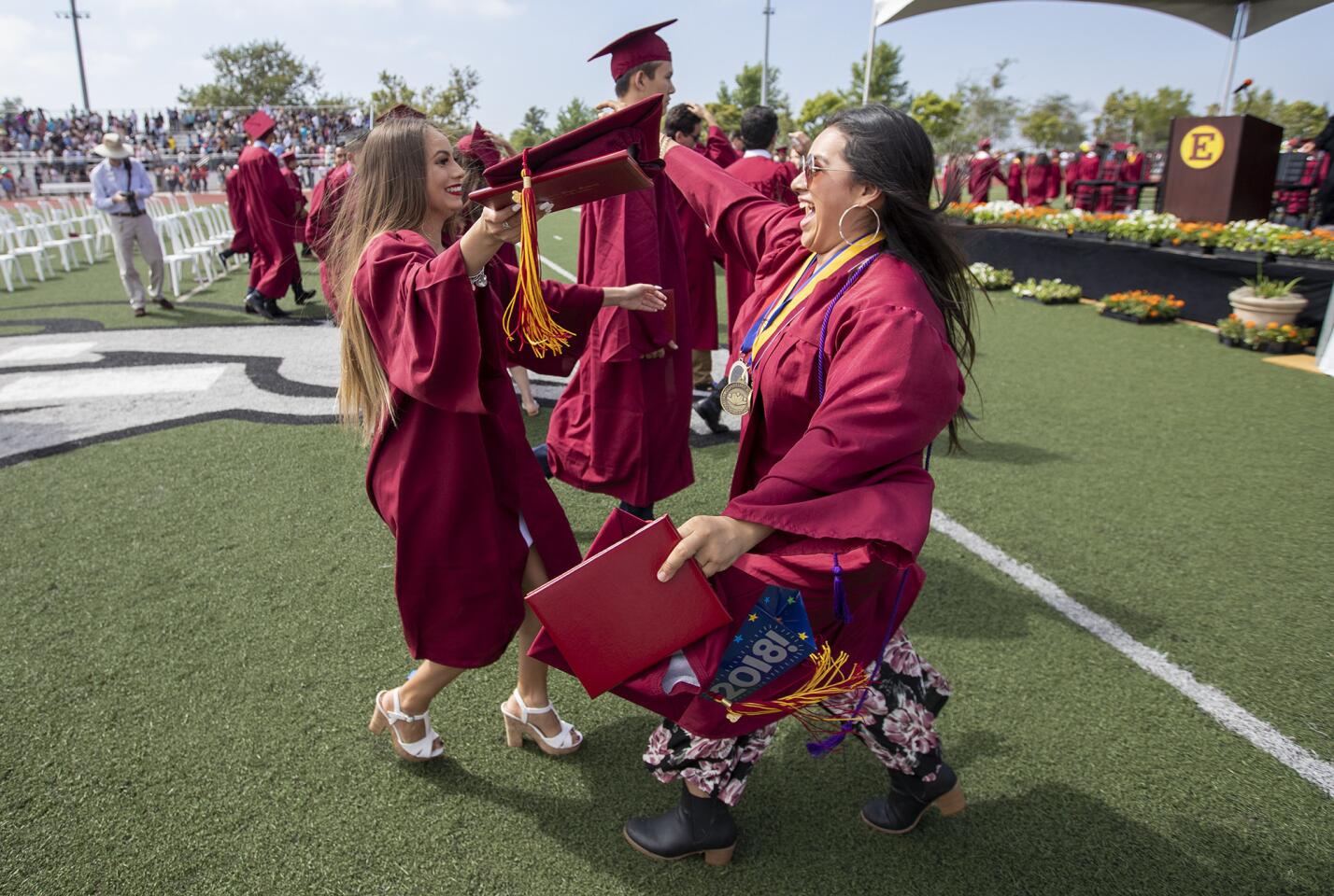 Brianna Joya, left, rushes to hug Juana Santoyo during the 2018 Estancia High School graduation commencement on Wednesday, June 20.