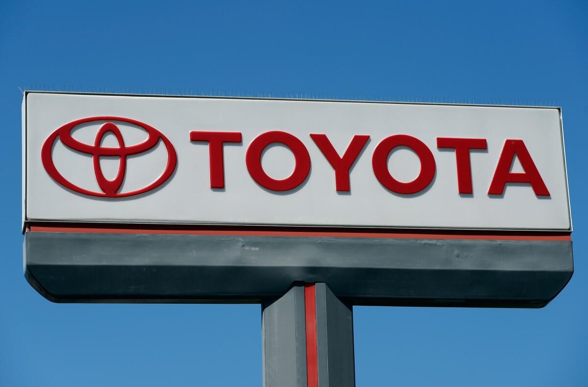The Toyota logo is displayed at a Los Angeles car dealership in April 2013