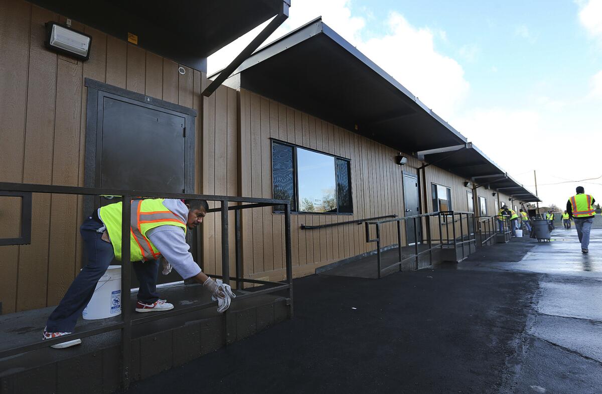 School district employee Silvereo Sanchez helps ready classrooms at Northridge Middle School.