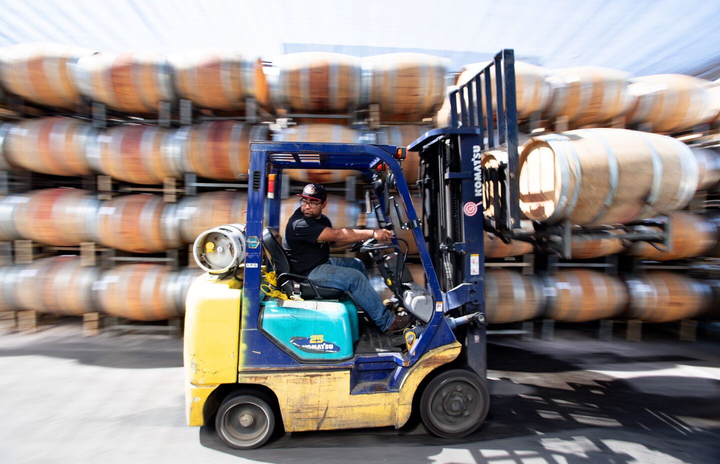 Samuel Garcia moves barrels of wine in a forklift at Alexander Valley Vineyards. The winery shipped 175,000 cases last year, mostly in the U.S.