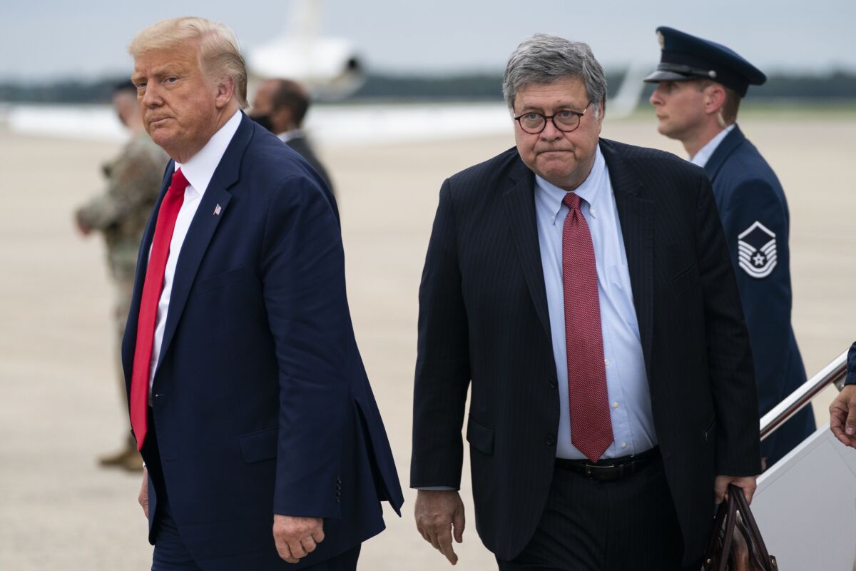 President Trump and outgoing Atty. Gen. William Barr at Andrews Air Force Base, Md.