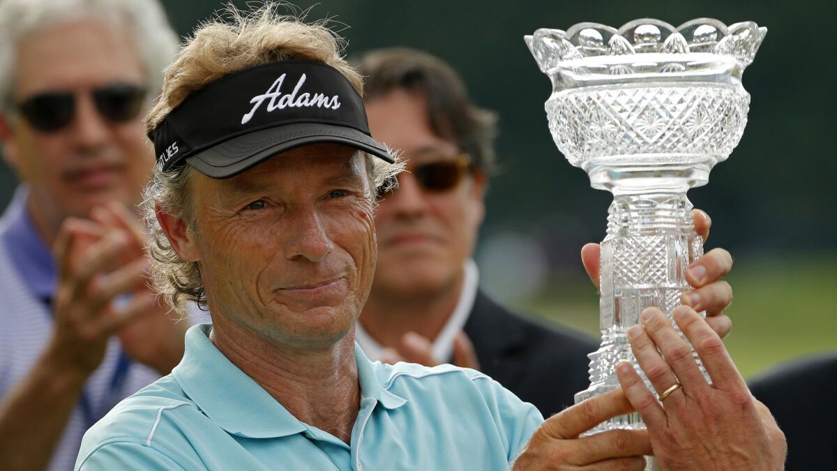 Bernhard Langer celebrates after winning the Senior Players Championship at Fox Chapel Golf Club in Pittsburgh on Sunday.