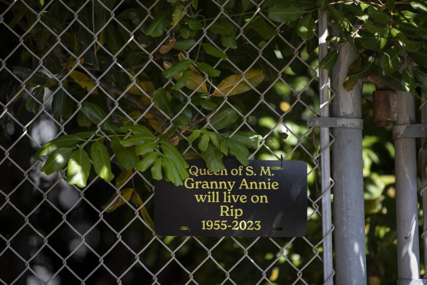 Serra Mesa, California - September 14: A memorial hangs for Annie Pershal who was shot and killed with a pellet gun on Thursday, Sept. 14, 2023 in Serra Mesa, California. Two men are accused of her death. One of which sent a text saying "I'm going hobo hunting with a pellet gun." Pershal was houseless but continued to stay in the area where she grew up. (Ana Ramirez / The San Diego Union-Tribune)