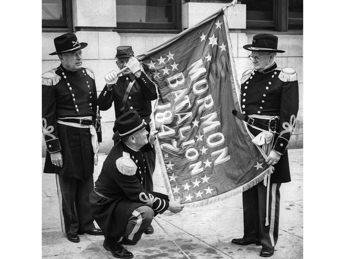 July 3, 1956: Members of the Mormon Battalion rehearse a July 4 ceremony to mark the raising in 1847 of the first American flag on Ft. Moore Hill.