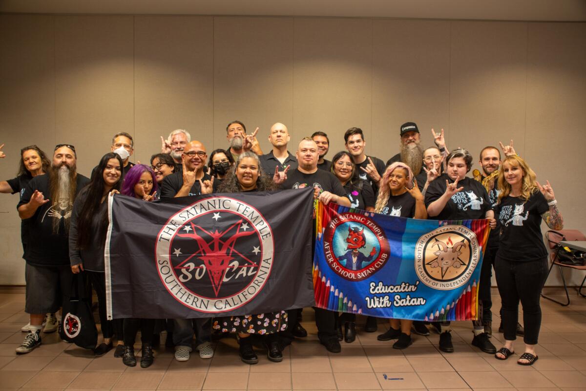 A group of volunteers holding banners 