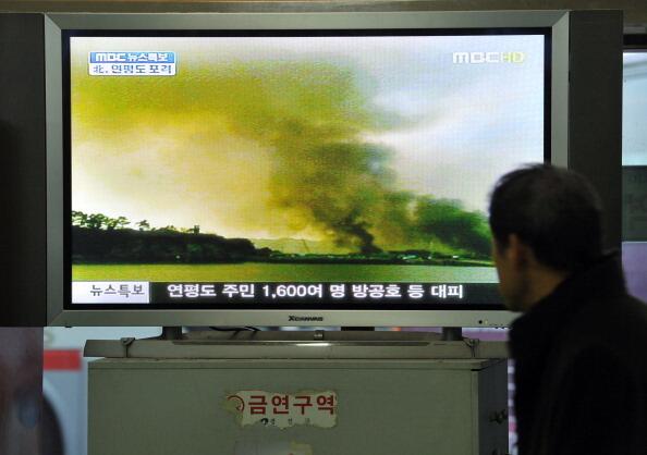 A South Korean man watches a public television