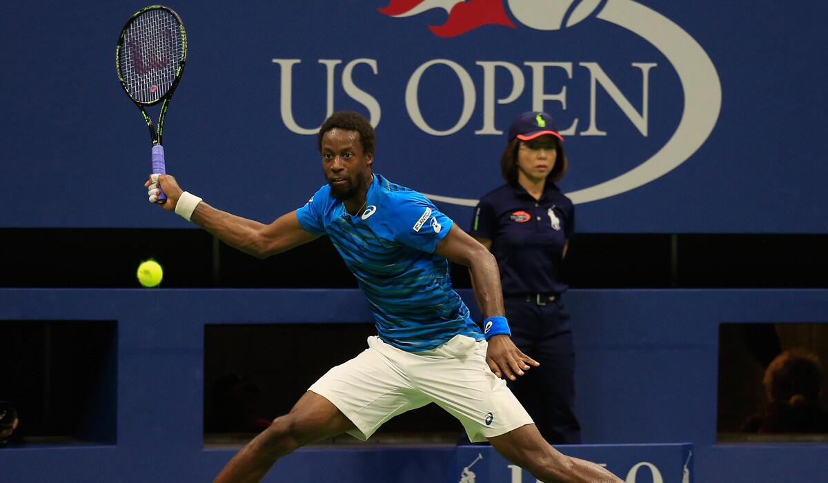 Gael Monfils returns a shot against Lucas Pouille during their men's singles quarterfinal match on Day 9 of the 2016 U.S. Open Tuesday.