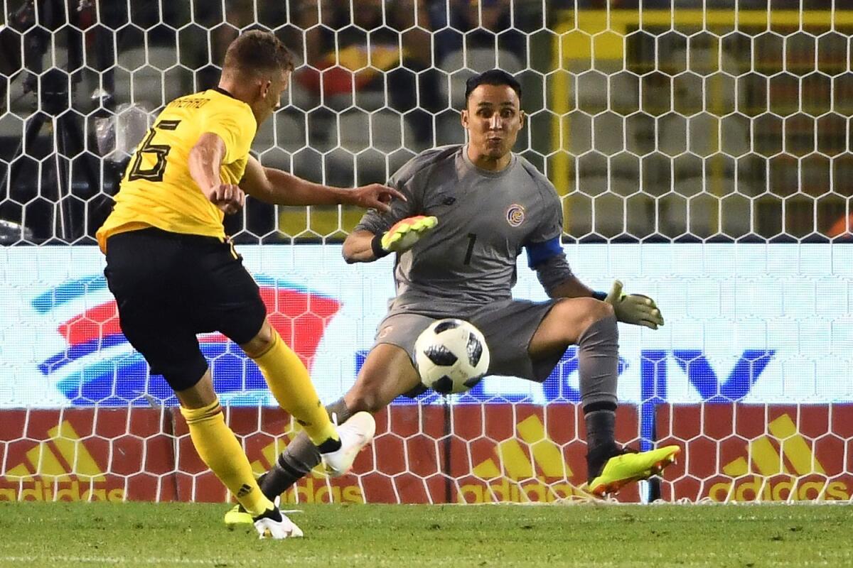 Costa Rica goalkeeper Keylor Navas stops a shot by Belgium's forward Thorgan Hazard on June 11.