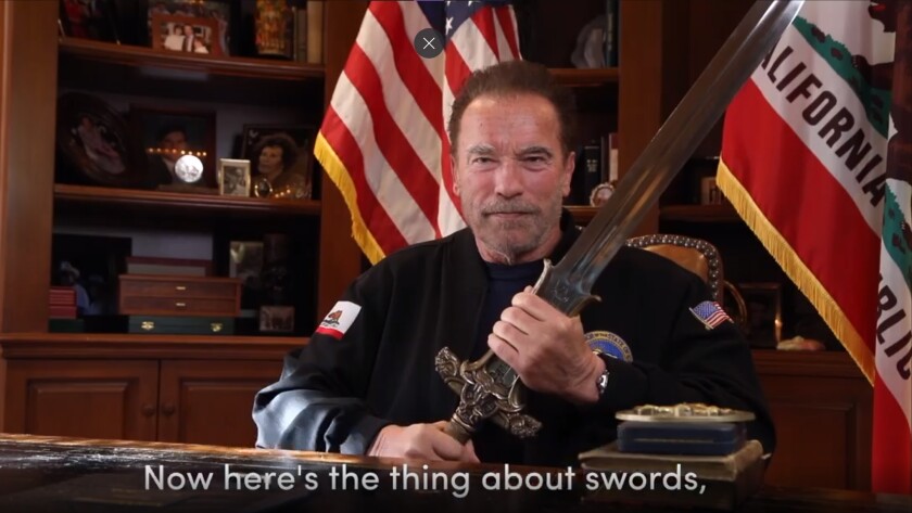 Former California Gov. Arnold Schwarzenegger holds a sword.