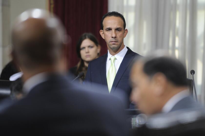 Los Angeles City Councilman Mitchell Englander listens during a Dec. 1 council meeting as representatives of Southern California Gas speak about the ongoing gas leak near Porter Ranch.