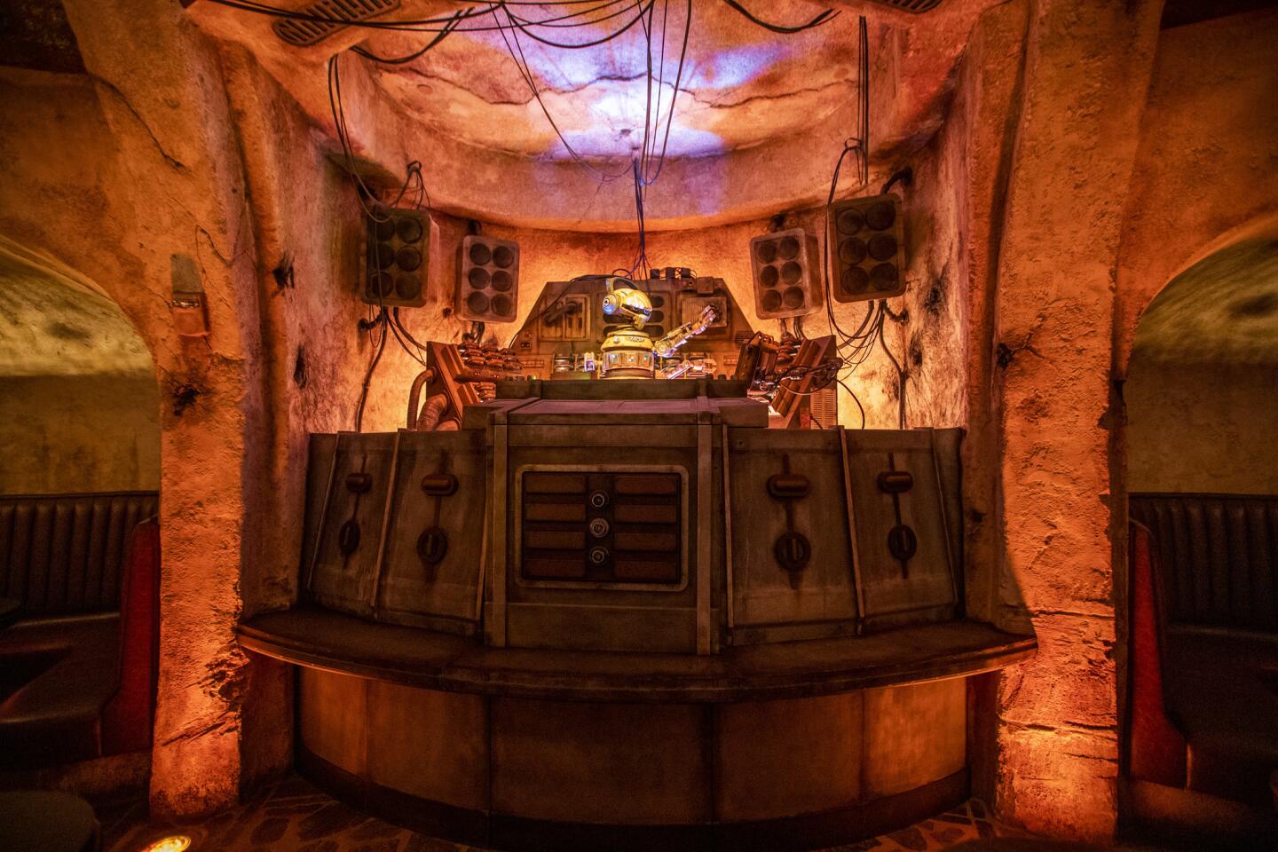 D.J. Rex works in Oga's Cantina after his space ship crashed as media members get a preview during the Star Wars: Galaxy's Edge media preview.