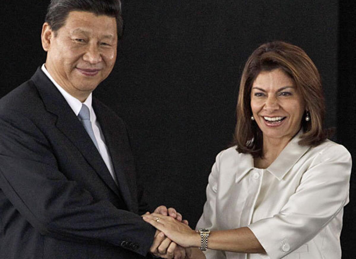 Chinese President Xi Jinping, left, and Costa Rican President Laura Chinchilla at the presidential house Monday in San Jose, Costa Rica.