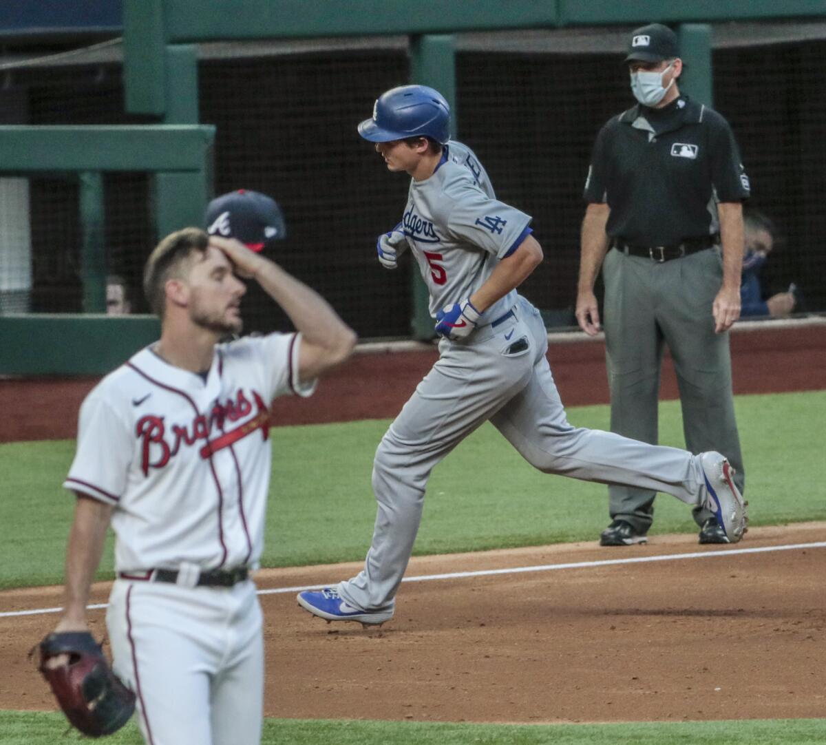 Dodgers shortstop Corey Seager rounds the bases after hitting a home run off Atlanta Braves relief pitcher Grant Dayton.