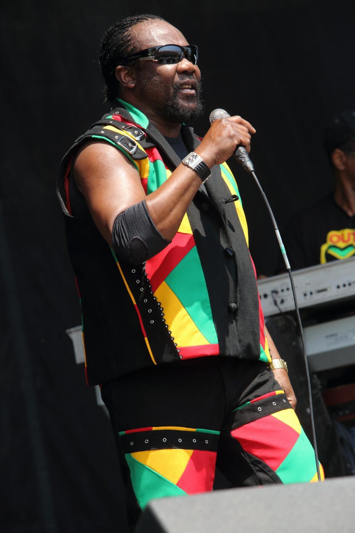 In this May 17, 2013 photo, Toots Hibbert, of Toots and the Maytals, performs at The Hangout Festival in Gulf Shores, Ala.