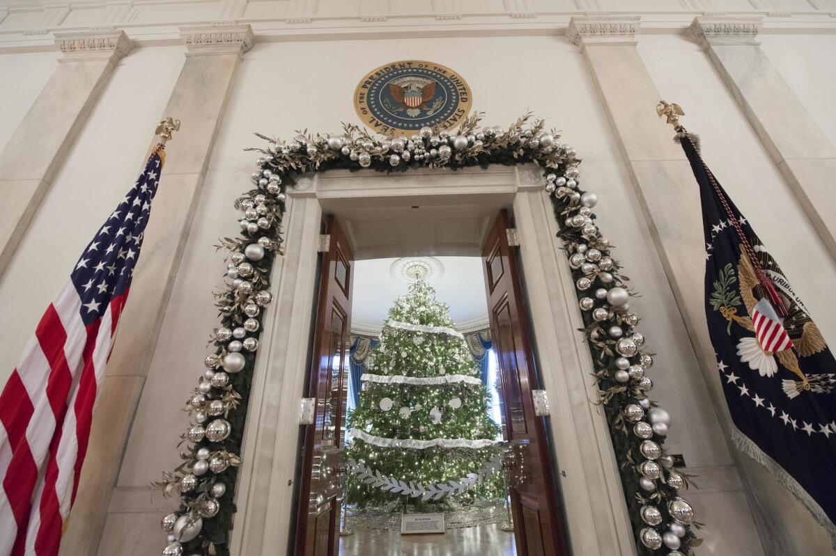 The White House Christmas Tree — a 19-foot Douglas fir donated by a tree farm in Pennsylvania -- was trimmed to fit into the Blue Room.