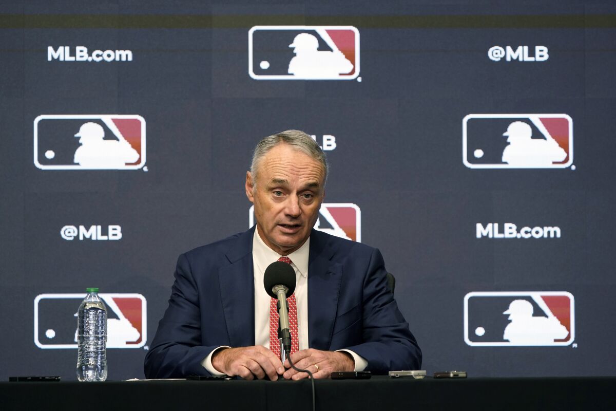 FILE - Major League Baseball commissioner Rob Manfred speaks during a news conference in Arlington, Texas, Thursday, Dec. 2, 2021. Major League Baseball and the players’ association are scheduled to meet Thursday, Jan. 13, 2022, in the first negotiations between the parties since labor talks broke off Dec. 1. The planning of the meeting was disclosed to The Associated Press by a person familiar with the negotiations who spoke on condition of anonymity because no announcement was made. (AP Photo/LM Otero, File)