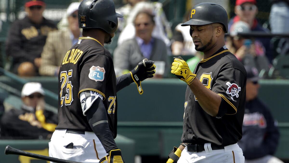 Pirates pitcher Francisco Liriano, right, is congratulated by teammate Gregory Polanco after hitting a home run during a spring trainin game March 21.