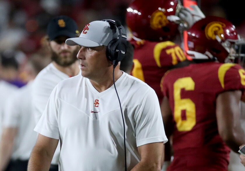 USC coach Clay Helton stands on the sideline during Saturday's loss to Stanford.