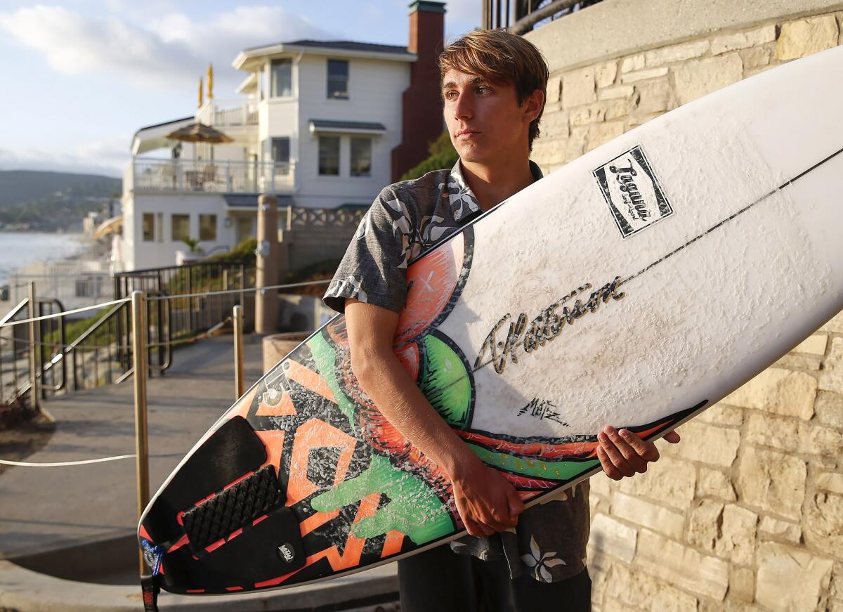 Brayden Belden stands at Brooks Street in Laguna Beach after a surf session.