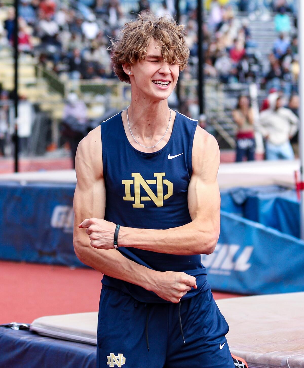 Sophomore JJ Harel of Sherman Oaks Notre Dame celebrates after setting school record in high jump at 6-10.25.