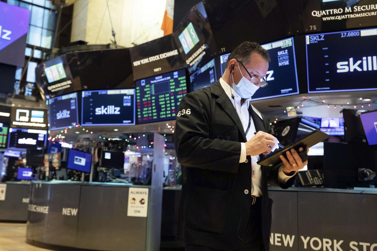 Trader Edward Curran works on the floor of the New York Stock Exchange on Thursday. 