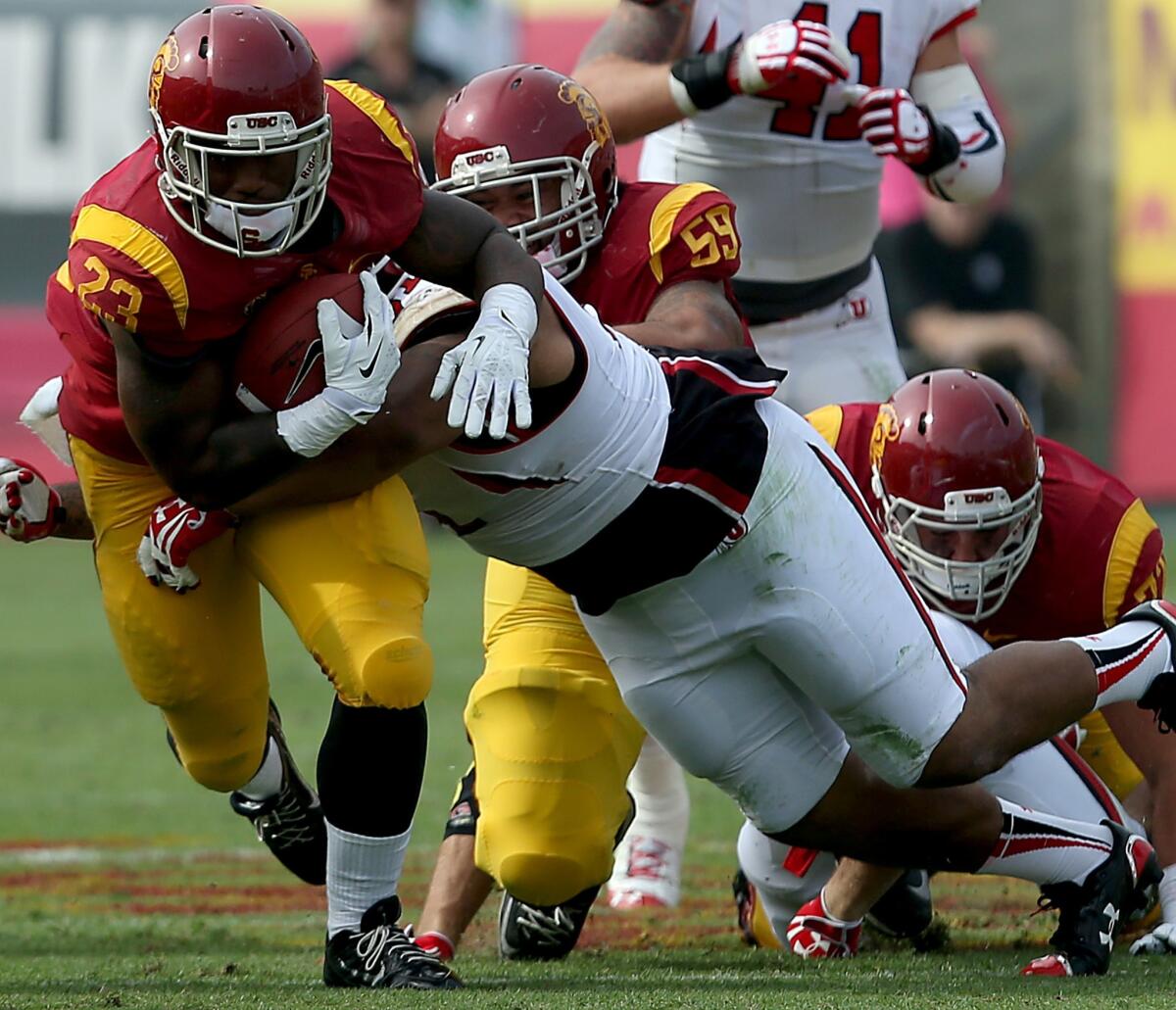 USC running back Tre Madden fights for extra yardage against Utah last season. Madden has not played this season because of a toe injury.