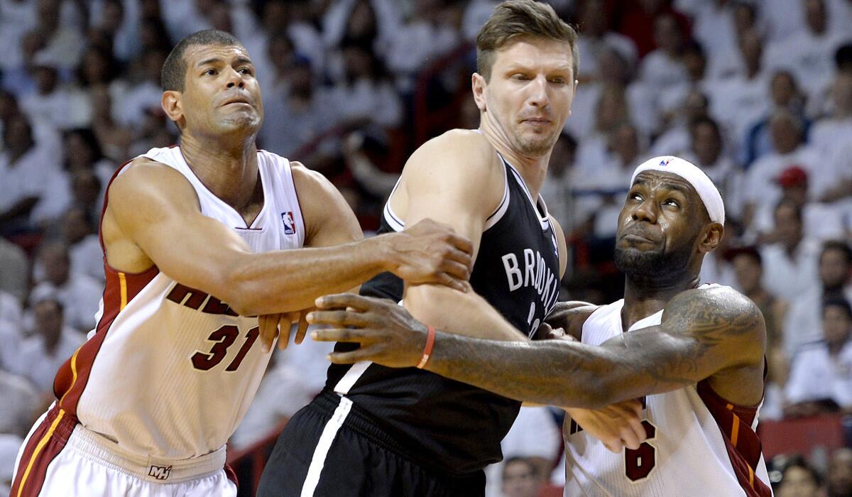 Heat forwards Shane Battier (31) and LeBron James (6) battle Nets forward Mirza Teletovic for rebounding position during Game 2 on Thursday night.