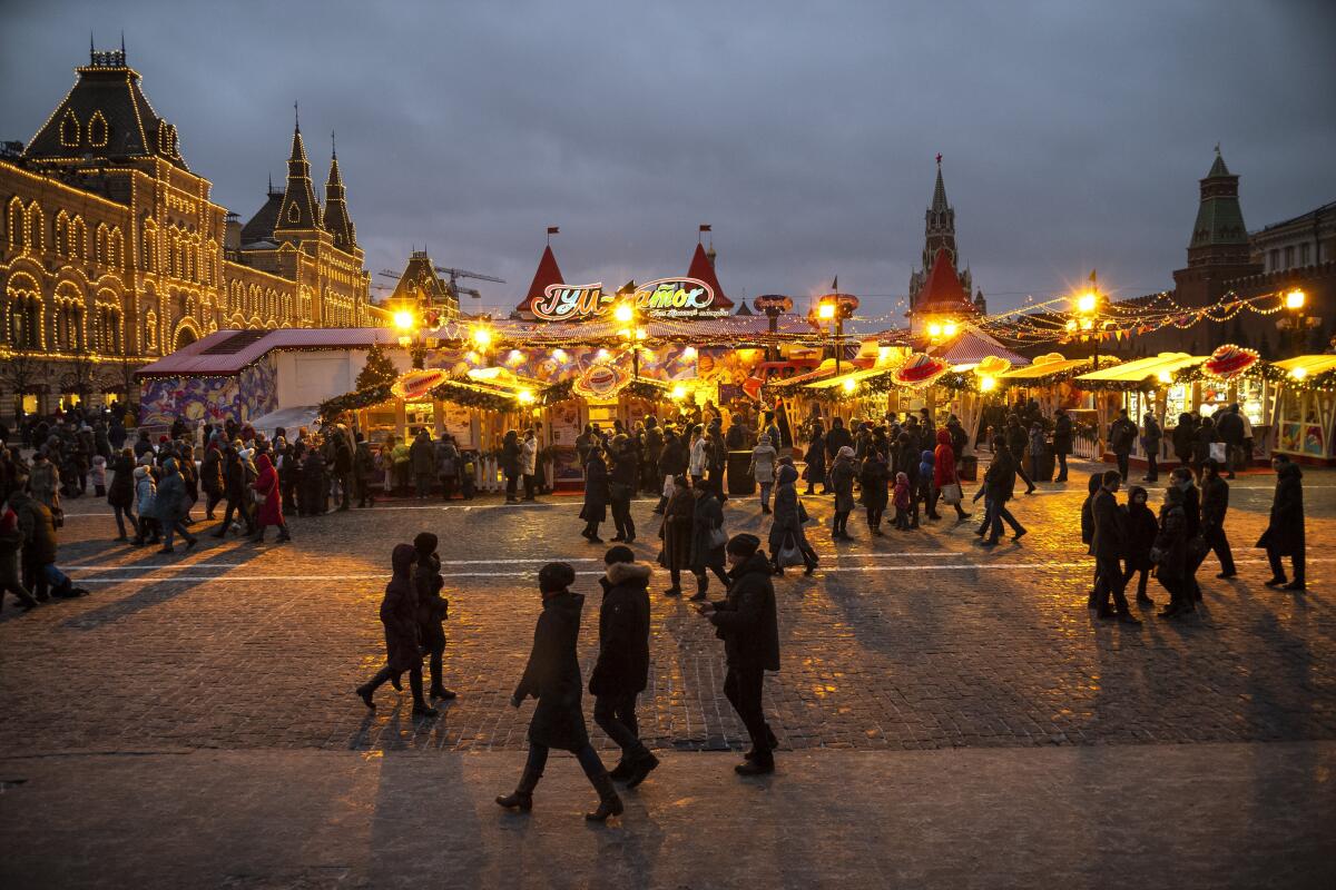 People shop at a holiday market on Moscow's Red Square.