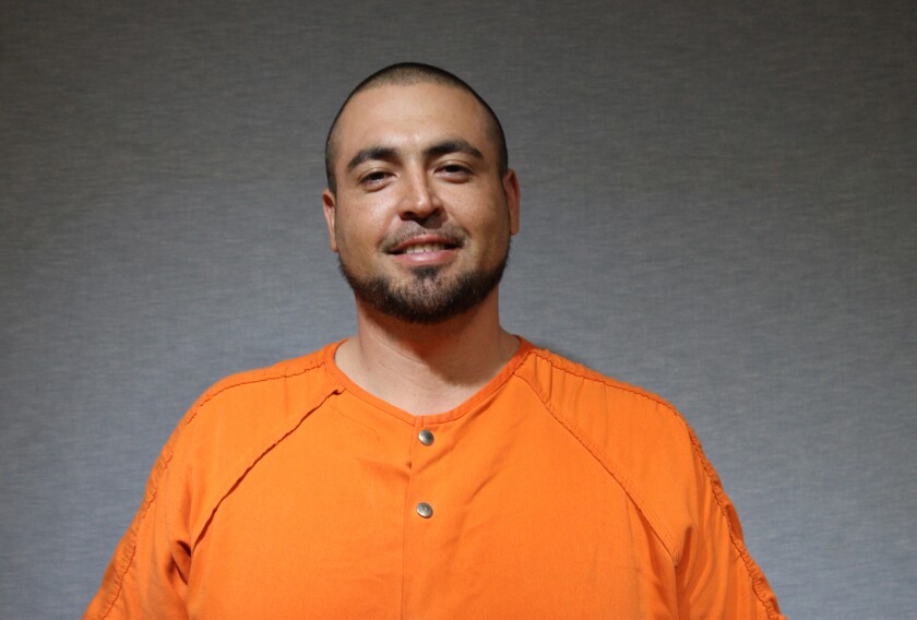This undated photo released by the Garland Police Department, shows Richard Acosta Jr., 33, a resident of Garland, Texas, who has been arrested and charged with capital murder, accused of being the getaway driver in a shooting Sunday night, Dec. 26, 2021, at a gas station convenience store in the suburb northeast of Dallas. Dallas-area police have released a 14-year-old boy whom they had suspected in a weekend shooting that left three teenagers dead and a fourth badly wounded, saying the gunman is still on the loose. (Garland Police Department via AP)