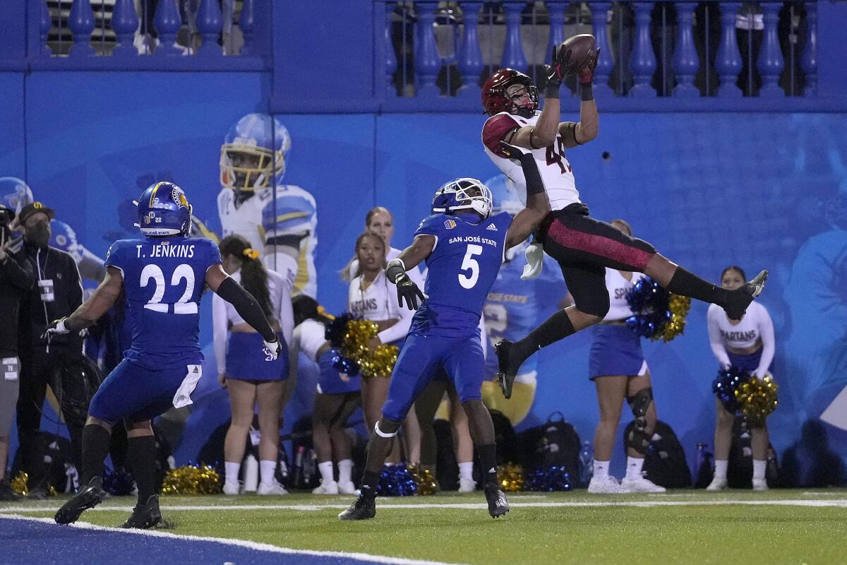 San Diego State wide receiver Jesse Matthews (45) catches a touchdown over San Jose State defensive back Bobby Brown II (5) for the game winning touchdown in double overtime in a NCAA college football game, Friday, Oct. 15, 2021, in San Jose, Calif. San Diego State won 19-13 in double overtime. (AP Photo/Tony Avelar)