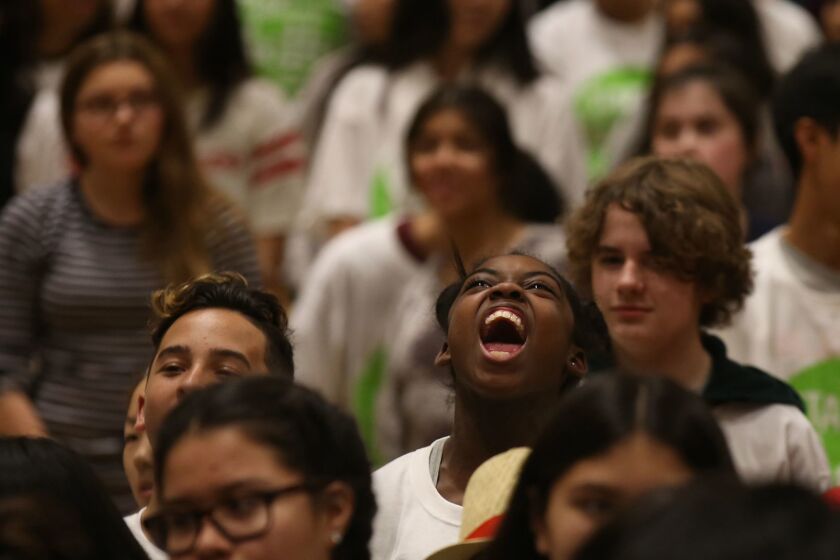 Alijah Haggins, 13, yells "hello" during a school-violence prevention program last week at Eagle Rock High School.