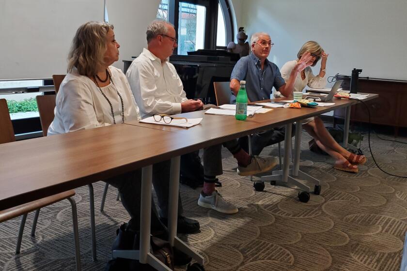 La Jolla Community Planning Association working group members Lisa Kriedeman, Bob Steck, Greg Jackson and Suzanne Baracchini preside over the meeting in which proposed bylaw revisions were discussed.