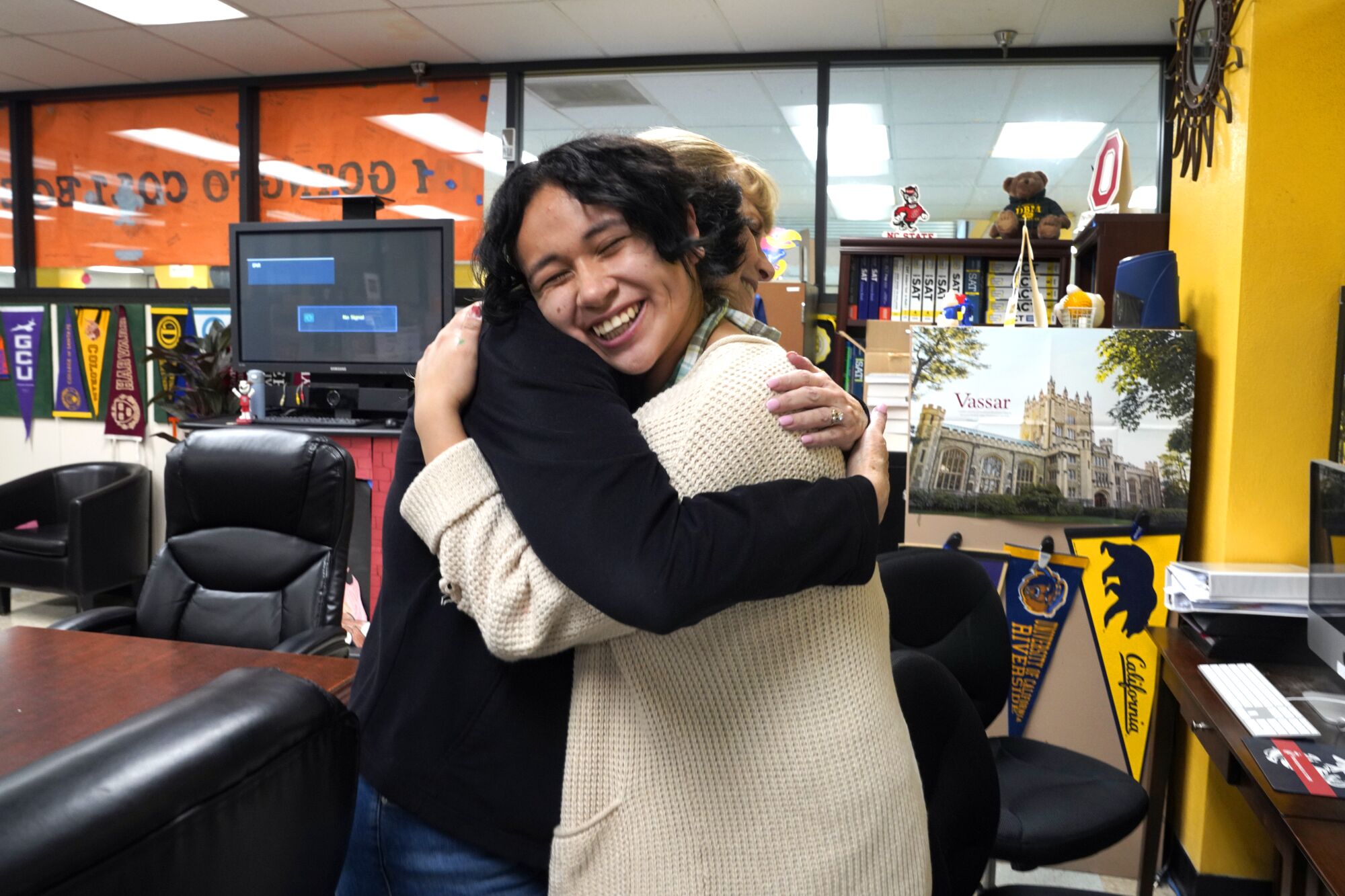 Lynda McGee hugs Emily Cruz.