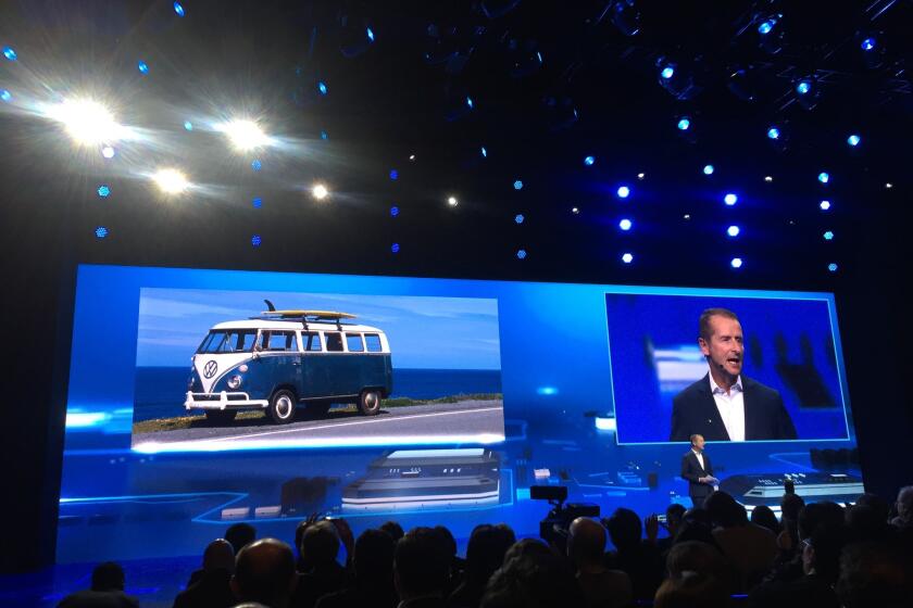 Volkswagen Passenger Cars Chairman Herbert Diess appears on stage at CES on Tuesday night.