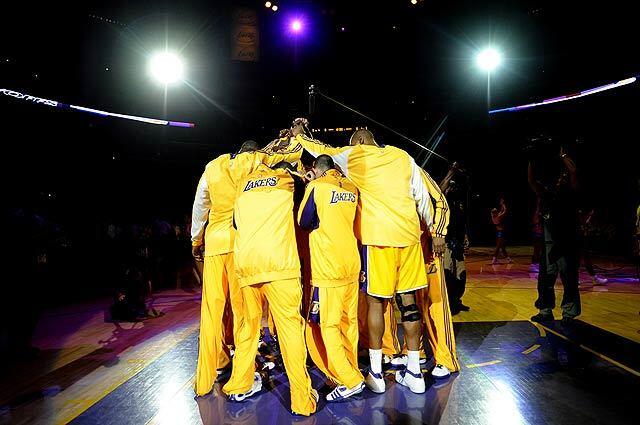 Laker players huddle before their game with the Houston Rockets in Game 1 of the Western Conference semifinal series at Staples Center.