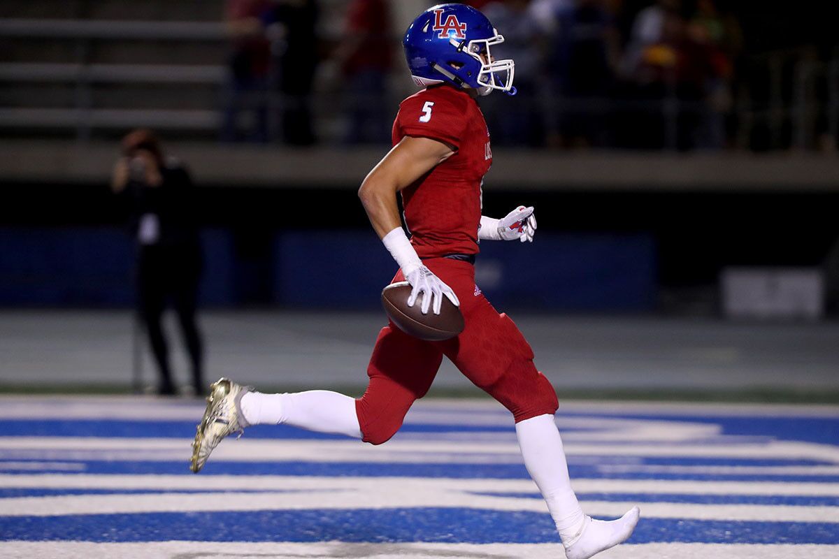 Los Alamitos High School football player #5 Keanu Norman lost a shoe while scoring a TD in home game vs. Newport Harbor High School at Cerritos College in Norwalk on Friday, Oct, 5m 2018. NHHS lost 7-42.