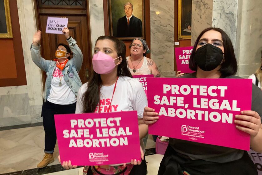 Abortion-rights supporters chant their objections at the Kentucky Capitol on Wednesday, April 13, 2022, in Frankfort, Ky., as Kentucky lawmakers debate overriding the governor’s veto of an abortion measure. The bill would put new restrictions on abortion, including banning the procedure after 15 weeks of pregnancy. (AP Photo/Bruce Schreiner)