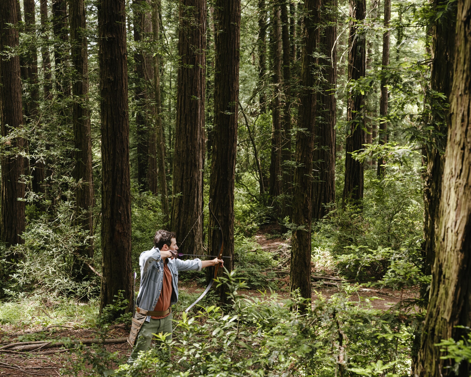 Jeff Bercovici shoots his bow at Redwood Bowmen archery range.