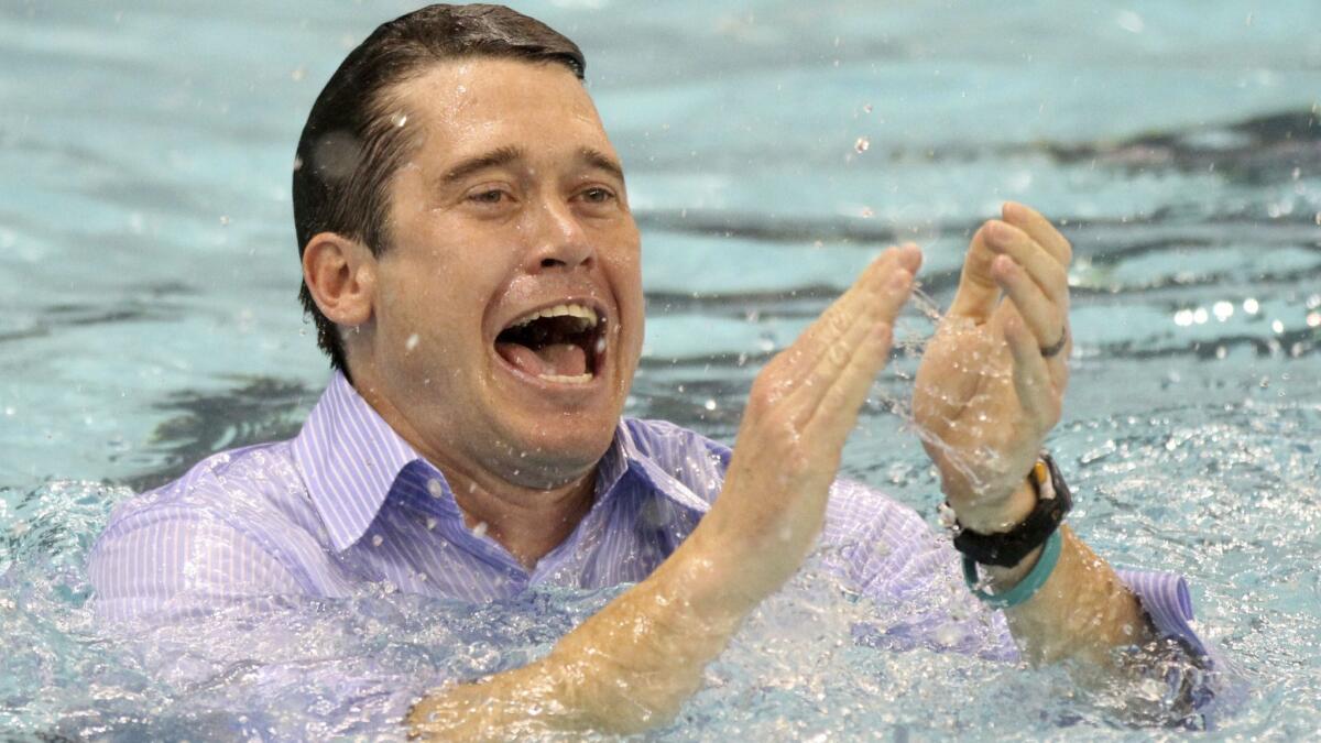 Dave Durden celebrates after California's win at the NCAA men's swimming and diving championships in 2011. Durden will coach the U.S. men's swim team at the 2020 Tokyo Olympics.