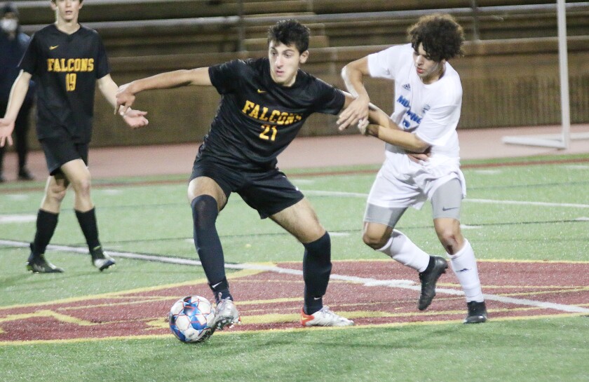 TP senior Andre Philibbosian tries to break free.