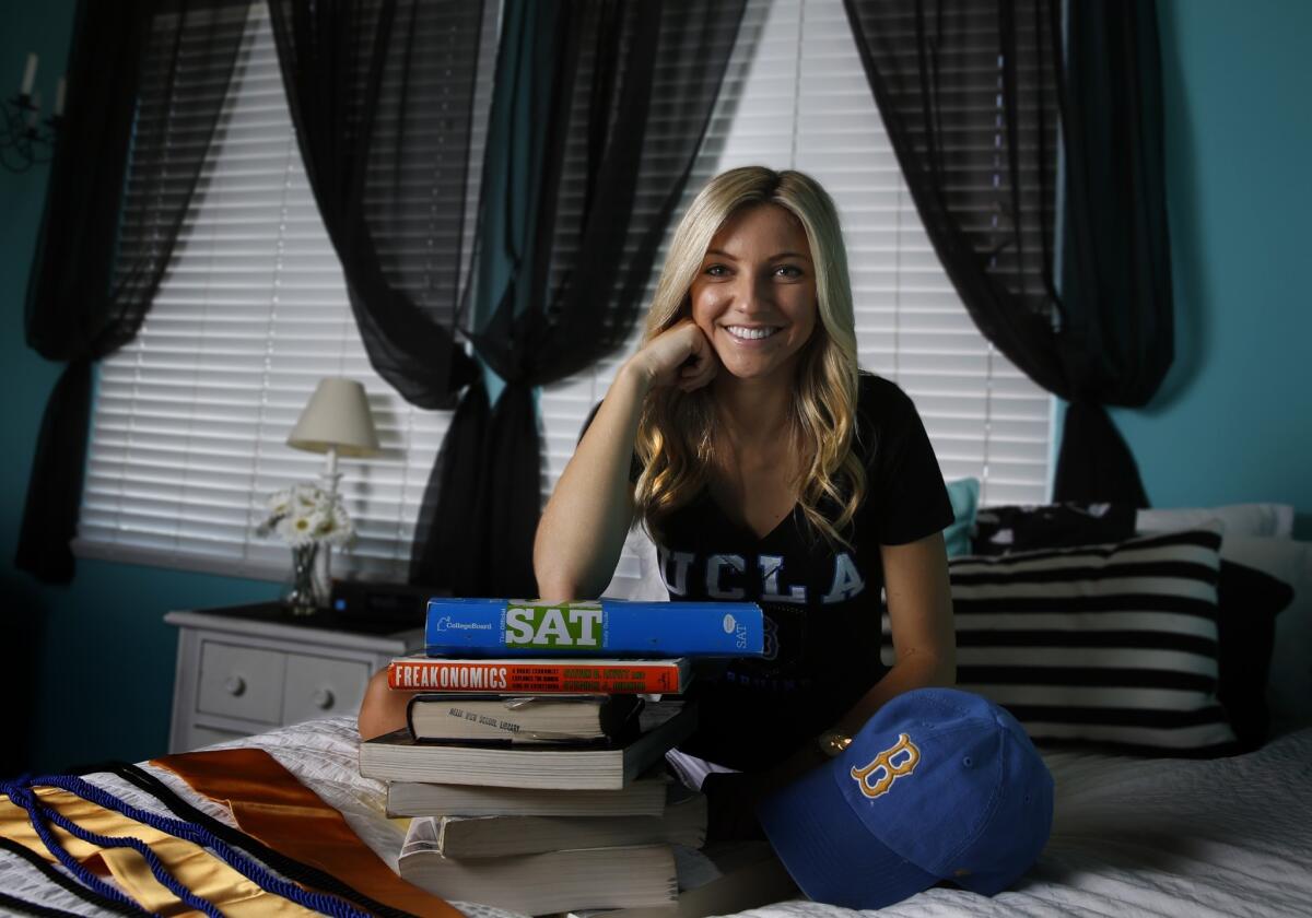 Madison Acampora is one of nearly 73,000 California public university students who were notified Monday that they would receive tuition credits under the new Middle Class Scholarship program. Acampora, shown at home in El Cajon, Calif., in June, has been accepted to UCLA.