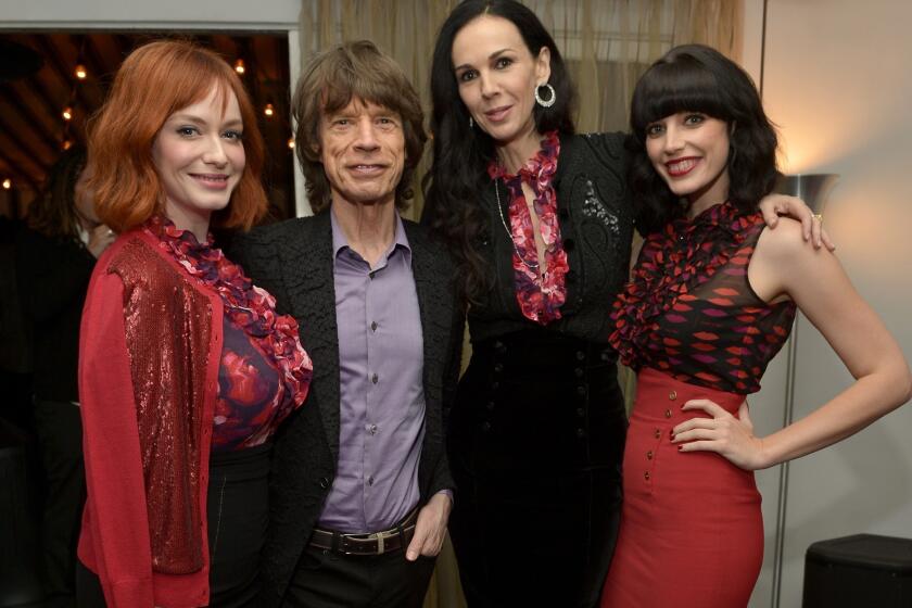 Actress Christina Hendricks, left, singer Mick Jagger, fashion designer L'Wren Scott and actress Jessica Pare attend the launch celebration of the Banana Republic L'Wren Scott Collection.